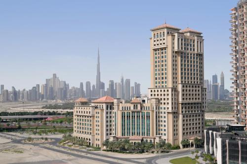 a group of tall buildings with a city in the background at Marriott Hotel Al Jaddaf, Dubai in Dubai