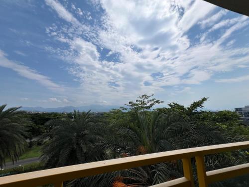 a view of a cloudy sky from a balcony at The Riverview Retreats in Wujie