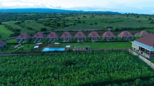 an aerial view of a resort in the middle of a field at Heart and Soul Lodge in Karatu