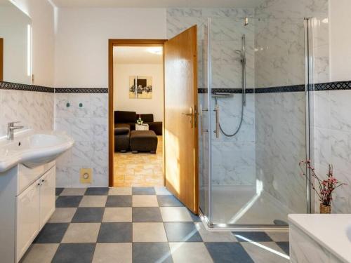 a bathroom with a shower and a sink at Fire Comfortable holiday residence in Ostseebad Koserow
