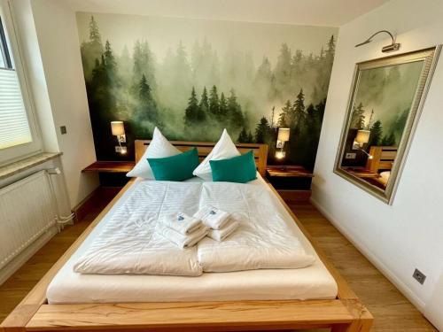 En eller flere senge i et værelse på Holiday apartment Harz holiday