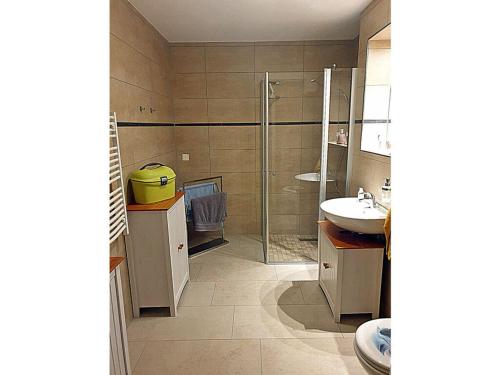 a bathroom with a shower and a sink at Carlo Comfortable holiday residence in Juliusruh