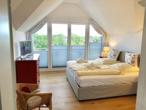 Ένα ή περισσότερα κρεβάτια σε δωμάτιο στο La Maison du Port Comfortable holiday residence