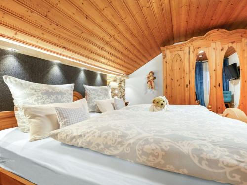 En eller flere senge i et værelse på Kirchberger Comfortable holiday residence