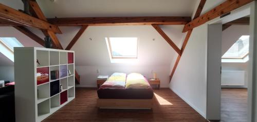 a bedroom with a bed in a attic at 7-Z Wohnung für 10 Personen im Süd-Schwarzwald nahe Schweiz in Waldshut-Tiengen