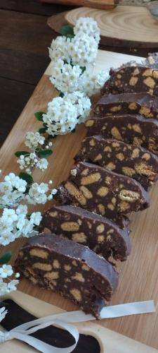 a group of brownies on a wooden cutting board at B&B22 in Santa Brigida