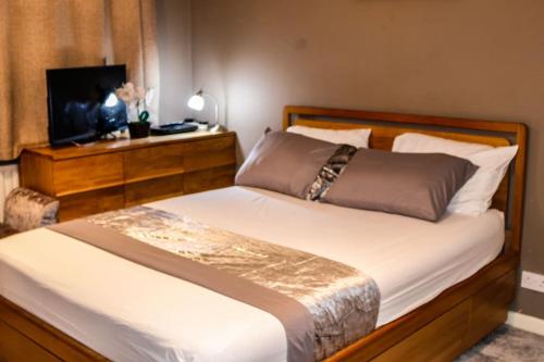 Katil atau katil-katil dalam bilik di Entire home in Bletchely Milton Keynes