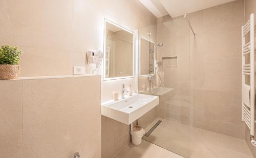 a white bathroom with a sink and a mirror at NEW! Luxury Villa Carlotte with 11m pool in Poreč
