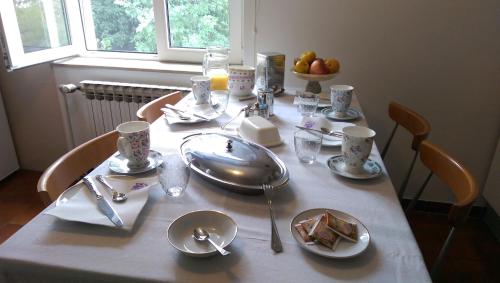 a table with plates of food on top of it at Apartments Frlan in Kastav