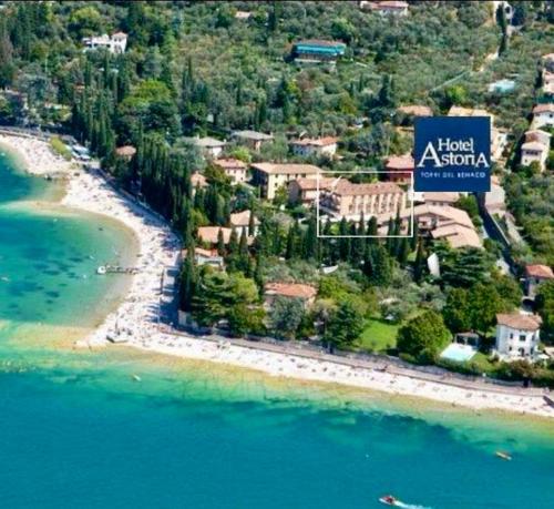 an aerial view of a resort on a beach at Hotel Astoria in Torri del Benaco