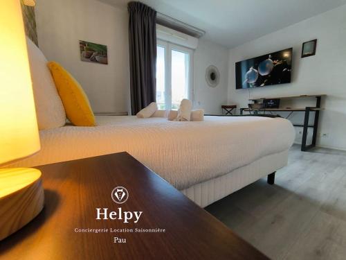 a hotel room with a large bed and a table at Les terrases du Roy in Idron