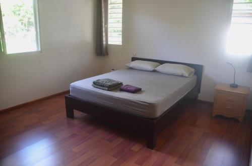 Postel nebo postele na pokoji v ubytování Papeete, appartement F3