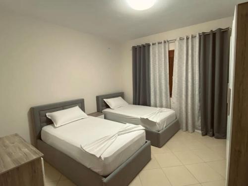 Postel nebo postele na pokoji v ubytování Cozy Corner - Apartment in Korça