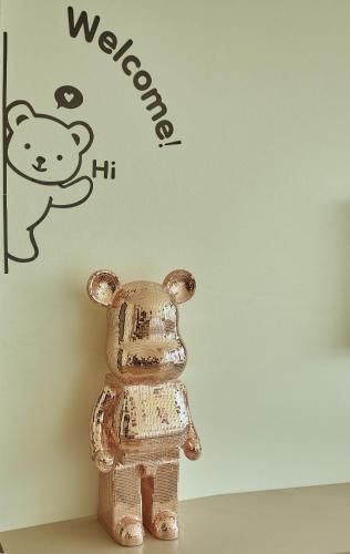 a teddy bear on a shelf in front of a wall at An's House SaPa - Nguyên Căn 5 Phòng Ngủ View Núi in Sa Pa