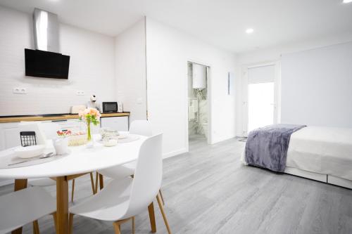 Postel nebo postele na pokoji v ubytování Huna Apartamentos