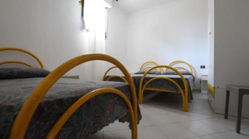 Postel nebo postele na pokoji v ubytování Residence La Pigna
