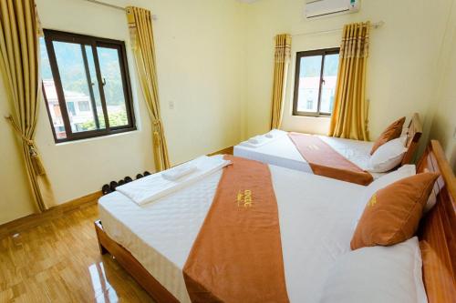 Postel nebo postele na pokoji v ubytování Hotel CÔ CÚC