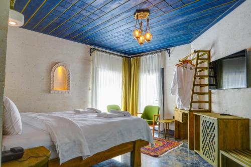 Postel nebo postele na pokoji v ubytování Motif Art Cappadocia