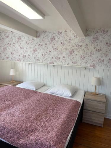 Cama o camas de una habitación en Den gamle Møllegård