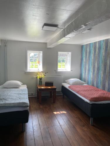 Cama o camas de una habitación en Den gamle Møllegård