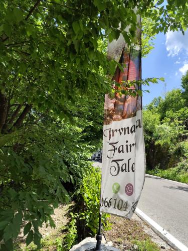 a sign on the side of a road at Brvnara Fairy Tale in Cetinje