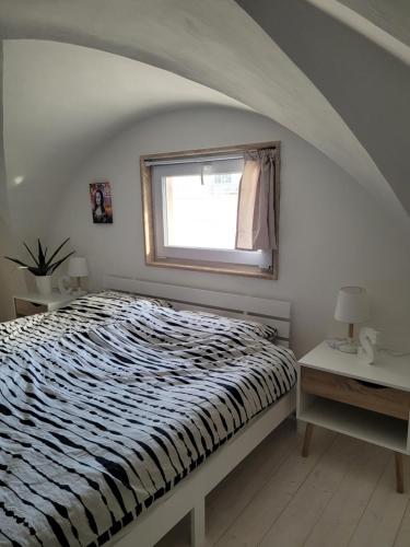 a bedroom with a bed and a window at CASA DEGLI ARANCI, smart work wifi garden terrace in Monteroni di Lecce