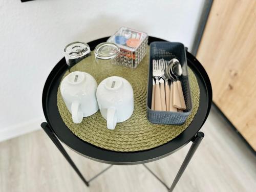 Příslušenství pro přípravu čaje a kávy v ubytování Lous Ferienhaus 1