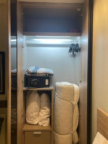 a room with a walk in closet with at Grand Blue Condominium by Mary in Mae Pim