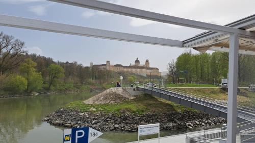 a bridge over a river with a building in the background at In der Wachau in Weissenkirchen in der Wachau