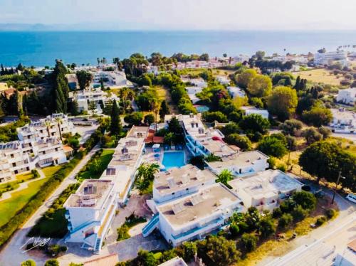 an aerial view of a town with white houses and the ocean at Urszula's apartment- apartment with pool in Kos in Psalidi