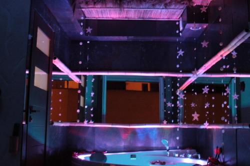 a bathroom with a tub and a mirror with stars at Kuredu / Uroa w Krainie Alicji in Ełk
