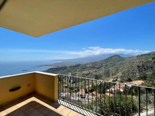 a balcony with a view of the ocean at Villa Da Vinci Luxury Panoramic Apartments - Taormina rooms collection in Taormina