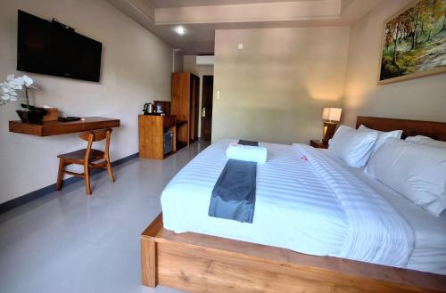 Postel nebo postele na pokoji v ubytování Bambu Lokha Guest house, Gianyar Bali