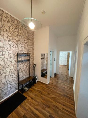 a hallway of a home with a stone wall at Keine Monteurswohnung in Duisburg