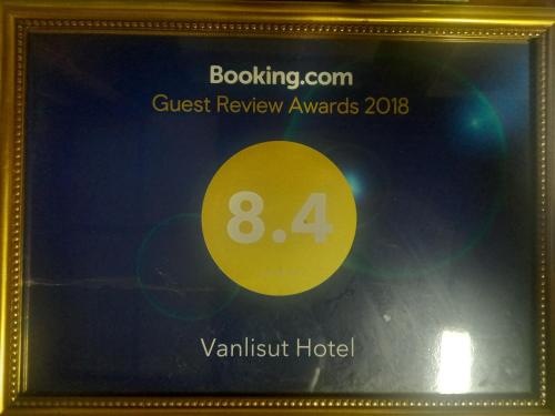 a framed picture of the guest review award for a hotel at Vanlisut Hotel Ngamwongwan in Nonthaburi