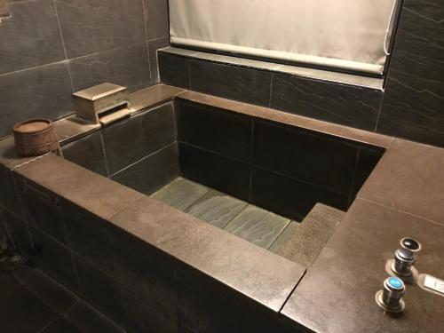 Kupatilo u objektu Shanshuiyue Hotel