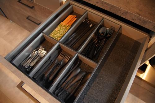 a drawer in a kitchen with utensils in it at PrivateVilla8 in Minamiawaji