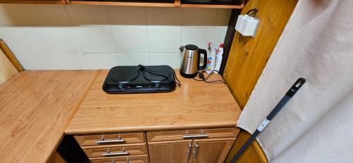 a kitchen counter with a toaster on top of it at Chatka Ema in Náchod
