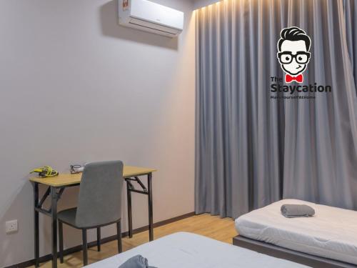 a room with a desk and a bed and a curtain at Staycation Homestay 32 The Echelon near Saradise in Kuching