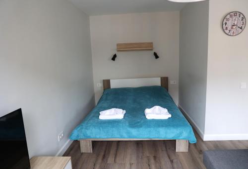 Postel nebo postele na pokoji v ubytování Cozy Studio in the city center