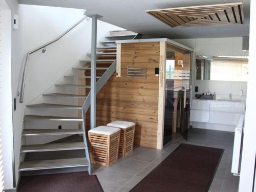a staircase in a room with a bathroom and a sink at Burk´s Scheune Comfortable holiday residence 