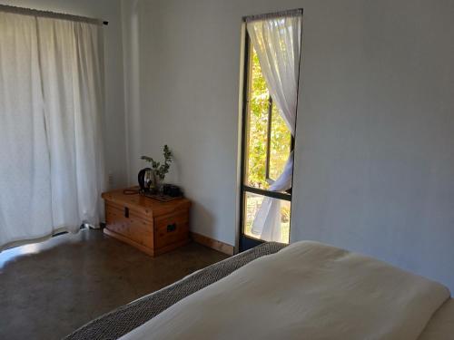 Postel nebo postele na pokoji v ubytování Deminimalistmanor