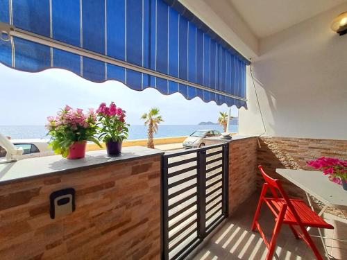 a balcony with a view of the ocean at Casa Michela in Letojanni