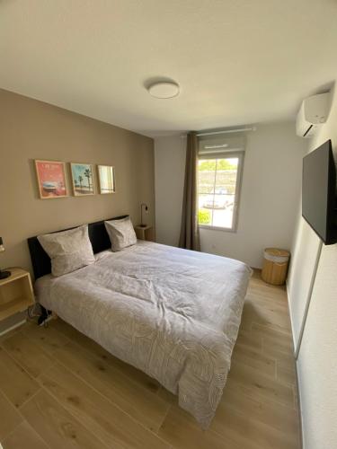 Ένα ή περισσότερα κρεβάτια σε δωμάτιο στο Appartement Carcassonne résidence capucins