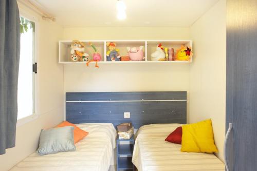 Katil atau katil-katil dalam bilik di Campeggio la Mariposa