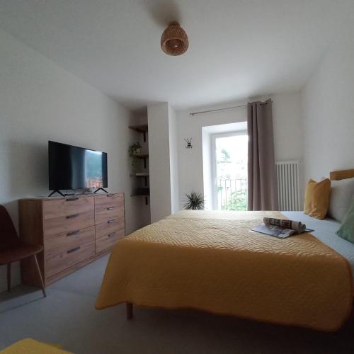 a bedroom with a bed and a television on a dresser at Casa Fornace in Ala