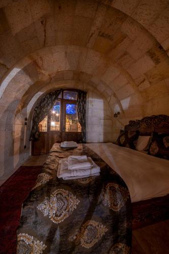 Un ou plusieurs lits dans un hébergement de l'établissement Capp Royal Cave HOTEL