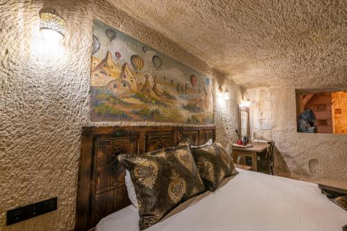 Un ou plusieurs lits dans un hébergement de l'établissement Capp Royal Cave HOTEL