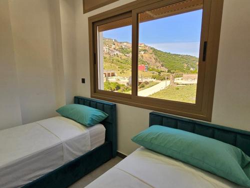Tempat tidur dalam kamar di Good Life Yellow and Ocean Holiday Apartments