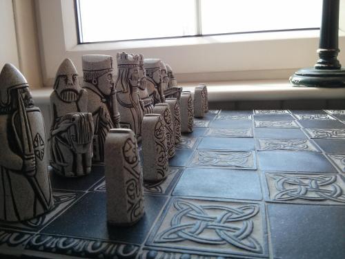 a group of artifacts sitting on top of a table at Airebroc House in Uig